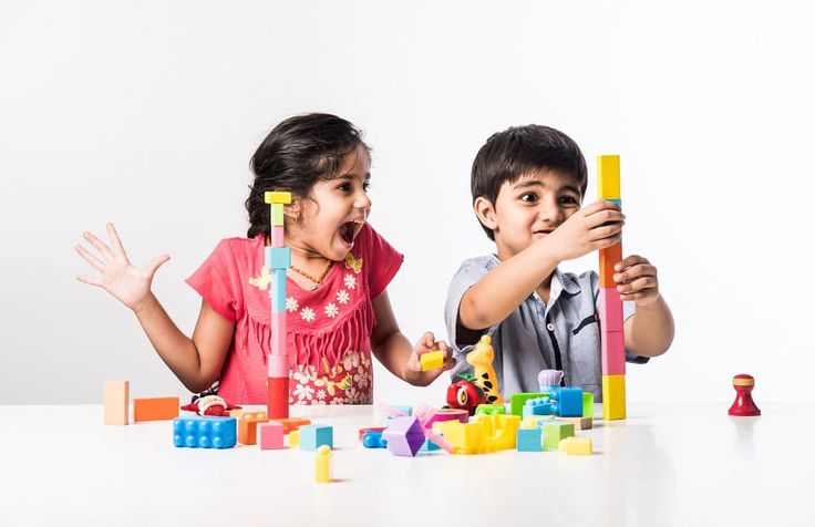 Children playing with colourful blocks